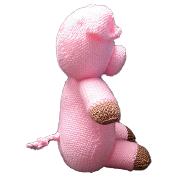 Hand knitted farm animal toy